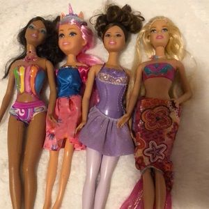 Lot of 4 barbie dolls